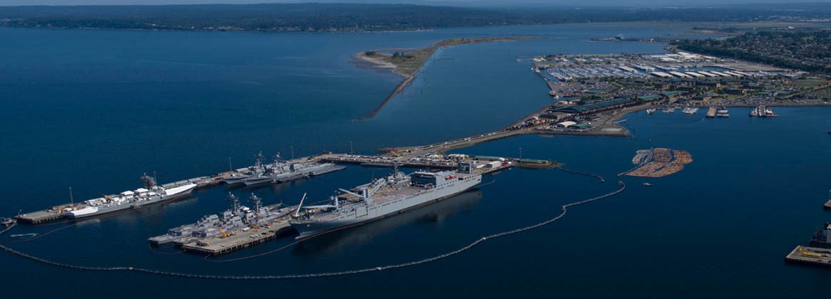 Naval Shipyard & Intermediate Everett Detachment operates refit piers and repair shops at Naval Station Everett, which sits next to the marina area of the city of Everett, Washington, 25 miles north of Seattle.